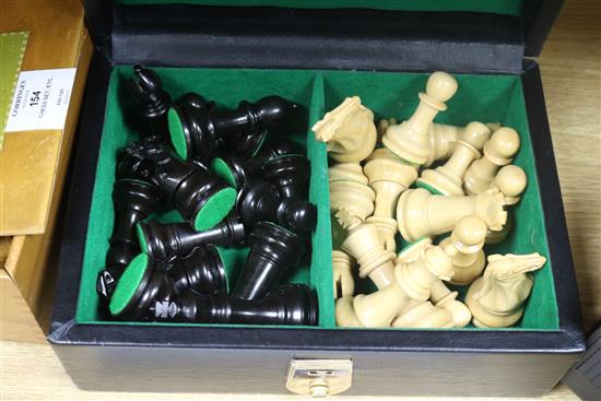 A weighted club-size chess set, two other boxed chess sets and a chess clock